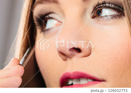 Serious young woman make phone call. 126032755