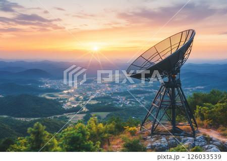 Scenic Sunrise Over Mountains with Satellite Dish in Soft Morning Light and Colorful Sky Scenic Sunrise Over Mountains with Satellite Dish in Soft Morning Light and Colorful Sky 126033539