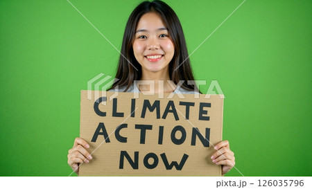 young woman holding climate action sign. 126035796