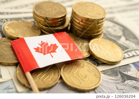 Canada flag on coin and banknote money, finance trading investment business currency. Canada flag on coin and banknote money, finance trading investment business currency. 126036204