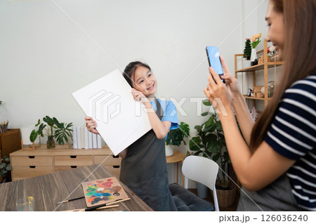 Family time capturing artistic moments with a phone Family time capturing artistic moments with a phone 126036240