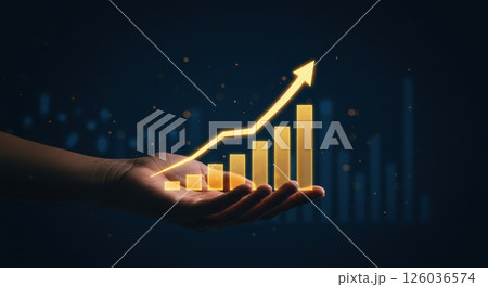 Hand gently holds a luminous golden line graph illustrating significant upward progress with an arrow against a rich indigo background. 126036574