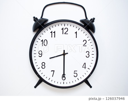 Black Retro Alarm Clock Showing 08:30 or 20:30. Classic Bell Style on White Wood Background. 126037946