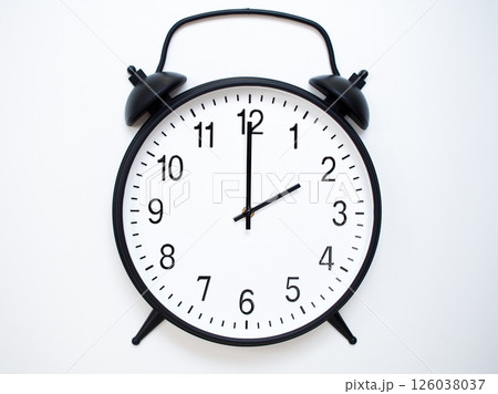 Black Retro Alarm Clock Showing 02:00 or 14:00. Classic Bell Style on White Wood Background. Black Retro Alarm Clock Showing 02:00 or 14:00. Classic Bell Style on White Wood Background. 126038037