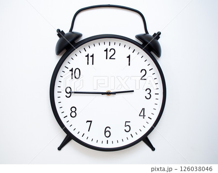 Black Retro Alarm Clock Showing 02:45 or 14:45. Classic Bell Style on White Wood Background. 126038046