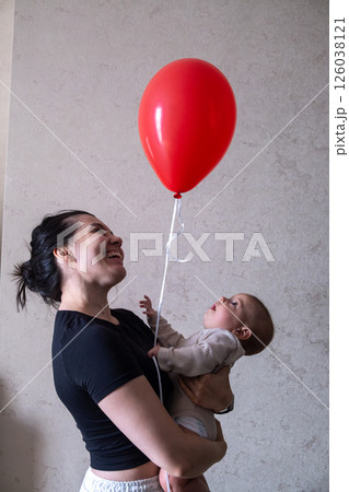 Mother and Baby with Red Balloon 126038121