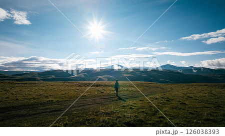 Aerial view of woman trail runner in high altitude mountains 126038393