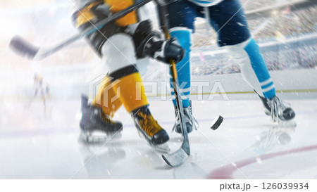 Close-up. Hockey game in an open stadium. Focused on the hockey puck. Two professional hockey player in action. Fight for the puck 126039934