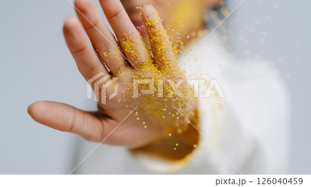 Hand covered in yellow pollen in a stop gesture, symbolizing protection from allergies and environmental irritants. Concept of seasonal allergy prevention and immune response. 126040459