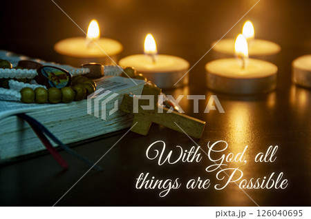 Illuminated scriptures with glowing candles show that walking with God fills life with peace and clarity. 126040695