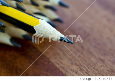 Pencil standing out representing Courage or Leadership with customizable space for text Pencil standing out representing Courage or Leadership with customizable space for text 126040711