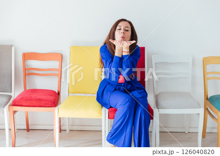 woman in blue business suit showing kiss 126040820