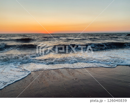 scenery beach and sea waves with sunset on the horizon 126040839
