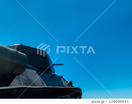 Military armored tank with cannon on blue sky Military armored tank with cannon on blue sky 126040843