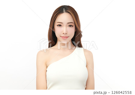 A beautiful young Asian woman with clean, fresh skin against a white background. Skincare, facial treatment, cosmetology, beauty, and spa. An elegant portrait of an Asian woman. A beautiful young Asian woman with clean, fresh skin against a white background. Skincare, facial treatment, cosmetology, beauty, and spa. An elegant portrait of an Asian woman. 126042558