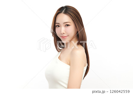 A beautiful young Asian woman with clean, fresh skin against a white background. Skincare, facial treatment, cosmetology, beauty, and spa. An elegant portrait of an Asian woman. A beautiful young Asian woman with clean, fresh skin against a white background. Skincare, facial treatment, cosmetology, beauty, and spa. An elegant portrait of an Asian woman. 126042559