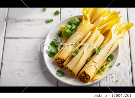 Freshly Crafted Tamales Served on a White Plate With Herbs in a Cozy Kitchen. Generative AI 126043261