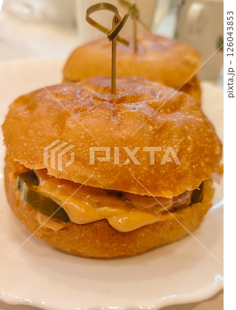 Close-up of a homemade hamburger, quick and delicious Close-up of a homemade hamburger, quick and delicious 126043853