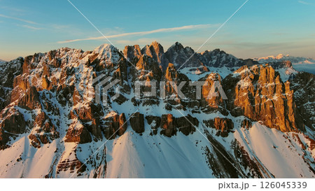 Rocky snow mountains at sunrise aerial Rocky snow mountains at sunrise aerial 126045339