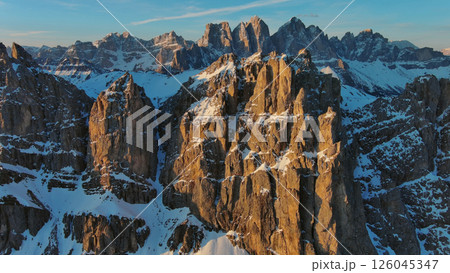 Rocky snow mountains at sunrise aerial 126045347