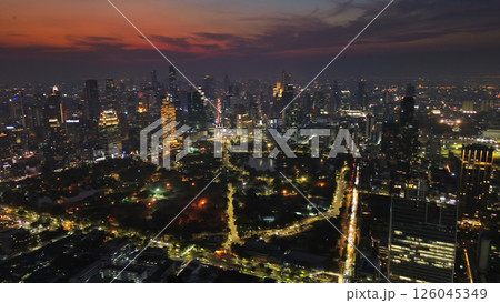 Illuminated skyscrapers and Lumpini park in Bangkok Illuminated skyscrapers and Lumpini park in Bangkok 126045349