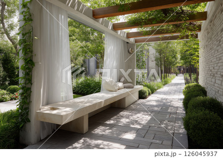 Garden bench under pergola with sheer curtains and lush greenery Garden bench under pergola with sheer curtains and lush greenery 126045937