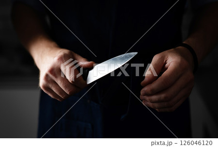 Dangerous Man Holds Sharp Knife In Darkness Dangerous Man Holds Sharp Knife In Darkness 126046120