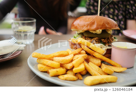 Big Meat Burger With Chips In Family Fast Food Restaraunt Big Meat Burger With Chips In Family Fast Food Restaraunt 126046184