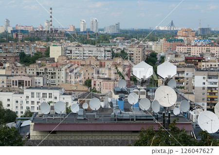Satellite dishes on house roof 126047627