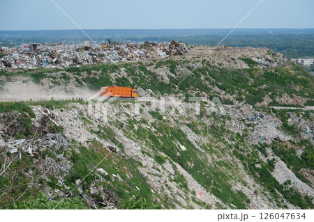 Garbage trucks at the city landfill 126047634