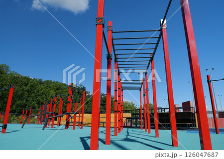 Sports ground with new exercise equipment in open air sport zone in the city 126047687