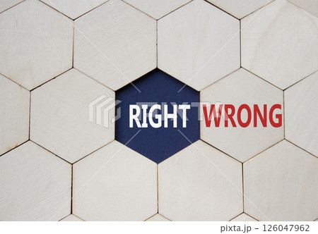 Right or Wrong symbol. Concept word Right or Wrong on wooden comb puzzle. Beautiful deep blue background. Business and Right or Wrong concept. Copy space 126047962