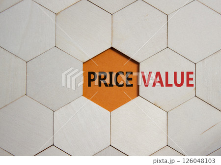 Price and Value symbol. Concept word Price and Value on wooden comb puzzle. Beautiful orange background. Business and Price and Value concept. Copy space 126048103