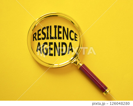 Resilience agenda symbol. Magnifying glass with words Resilience agenda. Beautiful yellow background. Business and Resilience agenda concept. Copy space. Resilience agenda symbol. Magnifying glass with words Resilience agenda. Beautiful yellow background. Business and Resilience agenda concept. Copy space. 126048280