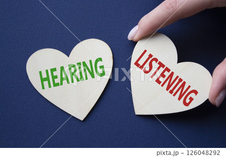 Growth and Stability symbol. Concept word Growth and Stability on wooden hearts. Businessman hand. Beautiful deep blue background. Business and Growth and Stability concept. Copy space Growth and Stability symbol. Concept word Growth and Stability on wooden hearts. Businessman hand. Beautiful deep blue background. Business and Growth and Stability concept. Copy space 126048292