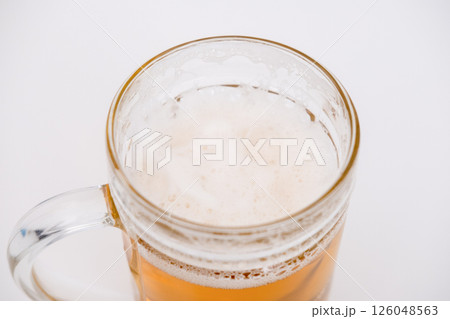 A glass of dark beer on a white background 126048563