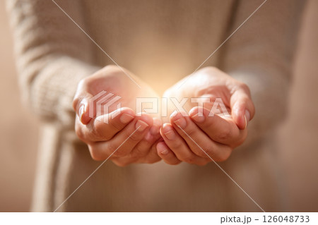 Healing energy in open female hands 126048733