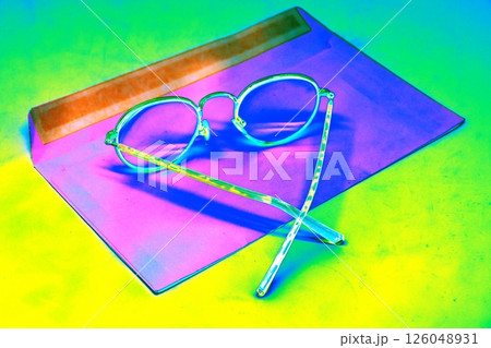 The glasses are in an open envelope. Corporate desktop, receiving correspondence. The glasses are in an open envelope. Corporate desktop, receiving correspondence. 126048931