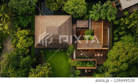 Elegant modern wooden house surrounded by lush greenery 126049520