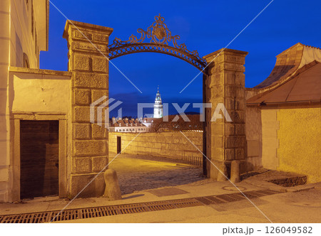 Night view of historic tower through gate, Cesky Krumlov, Czech Republic 126049582