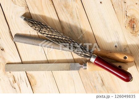 Top view of a Set of Rasps lying on wooden planks in a carpentry workshop 126049835
