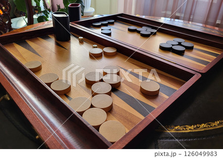 Close up of beautiful wood backgammon. board game Close up of beautiful wood backgammon. board game 126049983