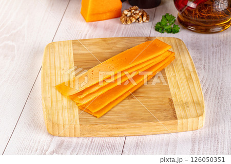 Yellow cheddae cheese slices snack Yellow cheddae cheese slices snack 126050351