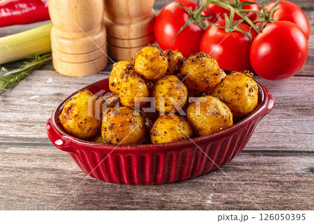 Baked small baby potato with herbs Baked small baby potato with herbs 126050395