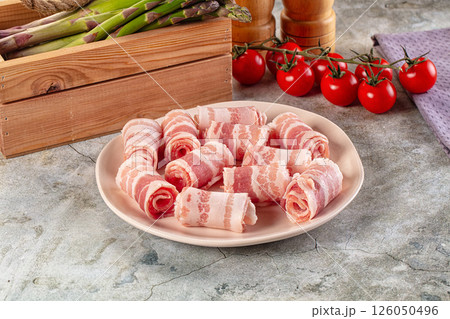 Raw bacon pork roll sliced Raw bacon pork roll sliced 126050496