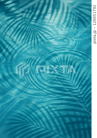 Clear Water Reflects Palm Leaves at Mid-Day in a Serene Tropical Setting Clear Water Reflects Palm Leaves at Mid-Day in a Serene Tropical Setting 126051792