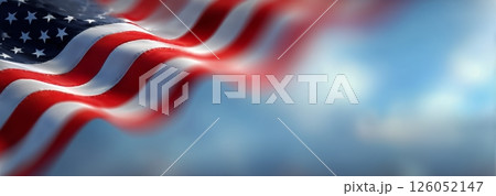 Waving American Flag Against a Clear Blue Sky During Daylight Hours 126052147