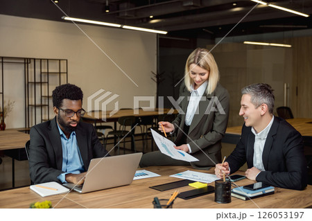 Group of business consultants having a brainstorming session in the office Group of business consultants having a brainstorming session in the office 126053197