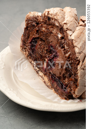 Delicious chocolate meringue cake with rich filling served on a decorative plate 126055392