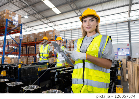 Portrait women worker holding tablet standing car parts in warehouse. Import-export shipping transportation, logistic business factory concept. 126057374